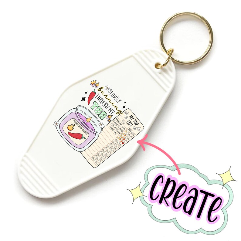 May include: White keychain with a colorful illustration of a candle with the text "Slowly burning through my TBR" and a checklist labeled "My TBR List".