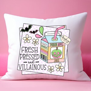 May include: White pillow with a colorful illustration of a juice box with a green apple and the text "Poison Apple Juice" and "Drink me if you dare". The text "Fresh Pressed... and... Villainous" is also on the pillow.