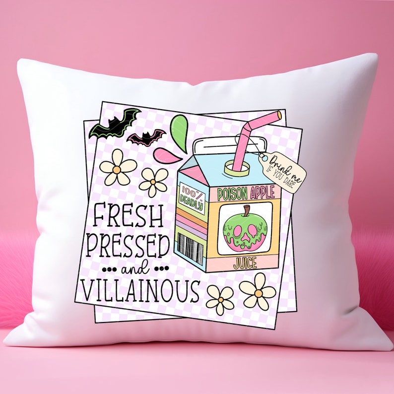 May include: White pillow with a colorful illustration of a juice box with a green apple and the text "Poison Apple Juice" and "Drink me if you dare". The text "Fresh Pressed... and... Villainous" is also on the pillow.
