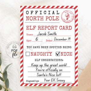 May include: A printable Elf Report Card with a red and white striped border. The card reads "Official North Pole Elf Report Card" and includes fields for name, age, and date. The card is marked "Nice" and has a message from the elf.