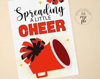 May include: A white poster with the words "Spreading a Little CHEER" in black and red. The image includes a red megaphone with black and red pom-poms and yellow star accents. The words "Instant Download PDF file" are also visible.