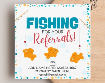 May include: A white card with a blue and orange polka dot background. The card says "FISHING FOR YOUR REFERRALS!" with a fishing rod and a goldfish on each side. The card also includes contact information for a business.