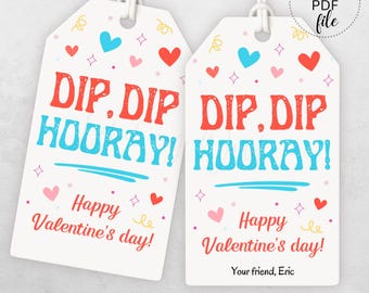 May include: Two white gift tags with red and blue text that says "Dip. Dip Hooray!" and "Happy Valentine's Day!" with hearts and stars in the background.