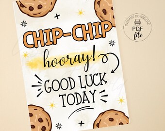 May include: A printable card with a white background and a yellow watercolor wash. The card features a cartoon illustration of chocolate chip cookies and the text "CHIP-CHIP hooray! GOOD LUCK TODAY".