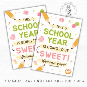 May include: Two printable school year tags with the text "This School Year Is Going To Be Sweet! Welcome back!" in green and pink. The tags feature illustrations of pencils, macarons, cotton candy, and a donut. The tags measure 2.5" x 3.5".
