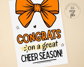 May include: White card featuring an orange bow illustration. The text reads "CONGRATS on a great CHEER SEASON!" in black and orange. A small heart and star are also included in the design. The card is labeled "INSTANT DOWNLOAD PDF file".