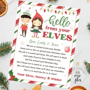 May include: A festive Christmas-themed printable featuring elf characters and the text "hello from your ELVES." The design includes red and green stripes, snowflakes, and a Christmas ornament illustration. The text is addressed to Emily & Jason.