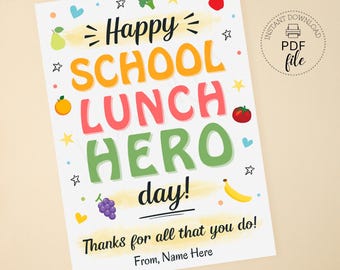 May include: A white printable card with colorful text and illustrations. The words "Happy SCHOOL LUNCH HERO day!" are displayed with fruit and vegetable graphics. The card also includes the text "Thanks for all that you do!" and "From, Name Here."