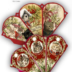 May include: Victorian Christmas cat cones. The red cones have gold filigree and illustrations of cats, holly, and the text "Happy Holiday". The heart-shaped cones have a vintage design, perfect for festive decor.
