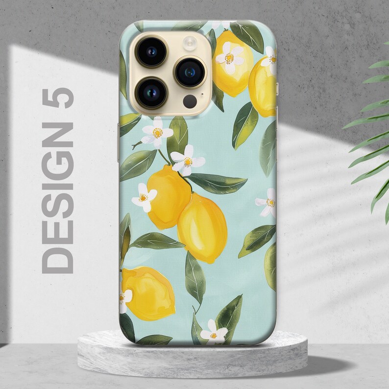 May include: A phone case with a light blue background and a pattern of lemons and white flowers. The case has a camera lens cutout and the text "DESIGN 5" on the left side.