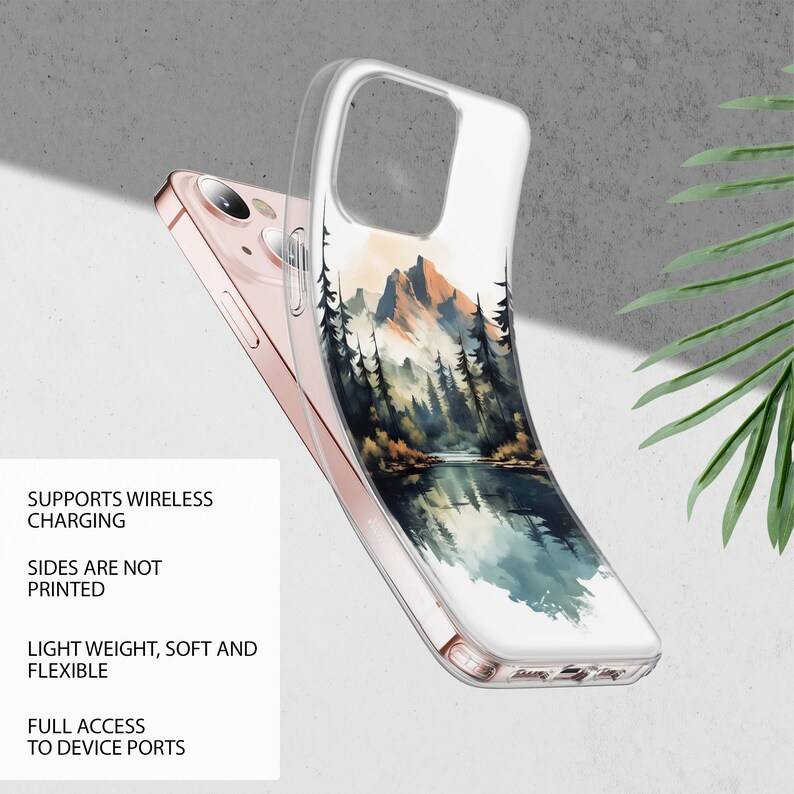 Puede incluir: Una funda transparente para tel&eacute;fono con un dise&ntilde;o de acuarela de una cordillera y un lago. La funda est&aacute; dise&ntilde;ada para admitir la carga inal&aacute;mbrica y tiene acceso completo a los puertos del dispositivo. Los lados de la funda no est&aacute;n impresos.