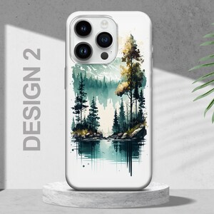 Puede incluir: Una funda de tel&eacute;fono blanca con un dise&ntilde;o de acuarela de una escena de bosque. La escena presenta un lago, &aacute;rboles y monta&ntilde;as en tonos verdes y azules.