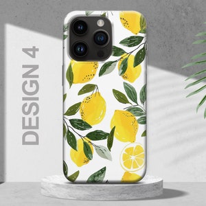 May include: White phone case with a design of yellow lemons and green leaves. The case has a camera lens cutout.