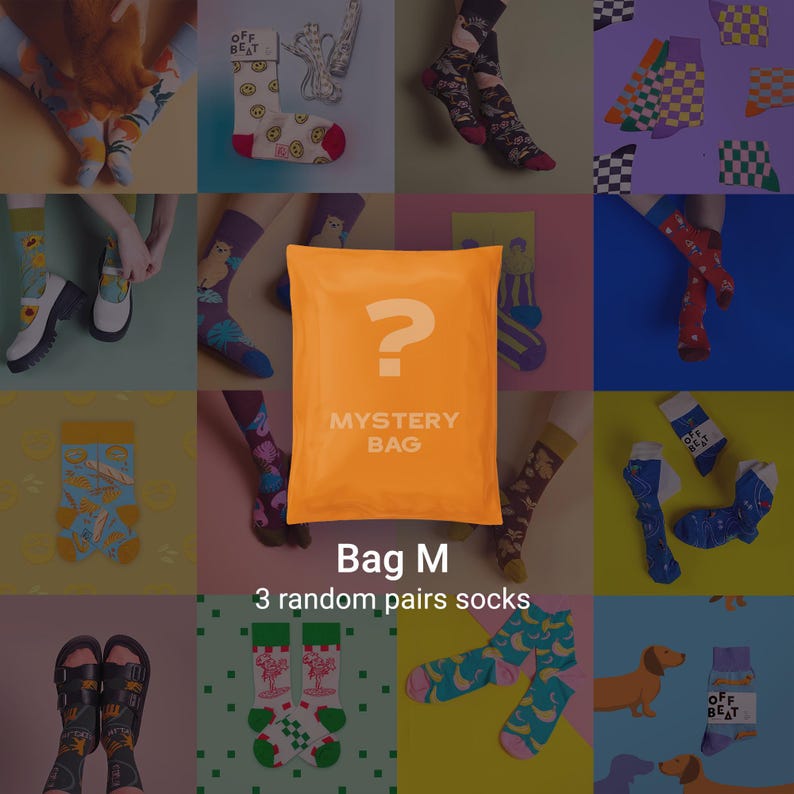 May include: An assortment of colorful socks, including pairs with fruit, smiley faces, and other patterns. An orange mystery bag with a question mark is in the center. Text reads "Bag M" and "3 random pairs socks".