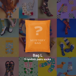 May include: An orange mystery bag with a question mark and the words "MYSTERY BAG" printed on it. The image shows various pairs of colorful socks with different patterns, including fruits, smiley faces, and checkered designs. The text "Bag L" and "5 random pairs socks" are also visible.