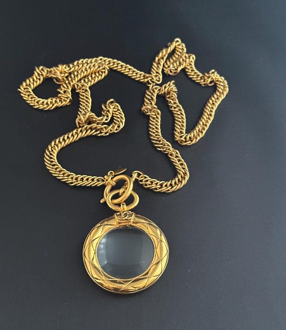 Vintage CHANEL 1980s Quilted Gold Tone Metal Magnifier Necklace.