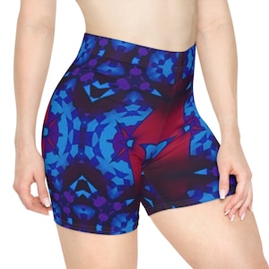 May include: Blue and red patterned athletic shorts with a geometric design. The shorts are made of a stretchy, comfortable fabric and are perfect for working out or running errands.