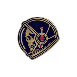 May include: A navy blue and gold enamel pin featuring a skull inside an astronaut helmet. The helmet has gold accents and a red circular design. The pin is a unique accessory.