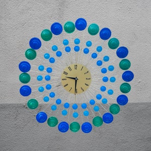 Wall Clock-Mid Century Modern Gold Starburst Clock                                         21in x 2in x 21in Metal w/ Blue, Green- DROPS