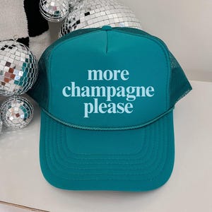 More Champagne Please Trucker Hat