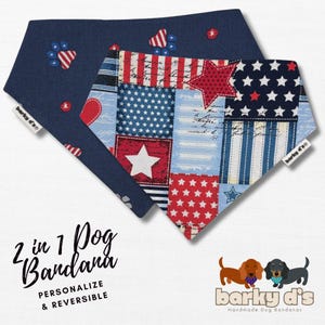 May include: Two triangular dog bandanas, one navy blue with red and white paw prints, the other featuring a patchwork design of stars, stripes, and script text in red, white, and blue. Text reads 2 in 1 Dog Bandana, PERSONALIZE & REVERSIBLE, barky d's.
