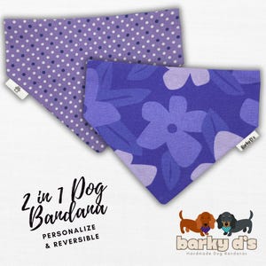 May include: A purple and white dog bandana with a polka dot pattern on one side and a floral pattern on the other side. The bandana is reversible and says "2 in 1 Dog Bandana" and "Personalize & Reversible".