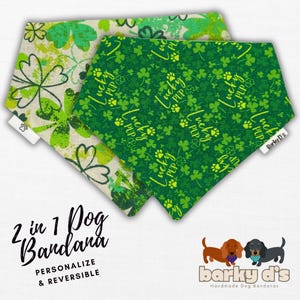May include: Two reversible dog bandanas with a green shamrock and paw print pattern. One side says "Lucky Pup" and the other side has a more abstract shamrock pattern. The bandanas are made by Barky D's.