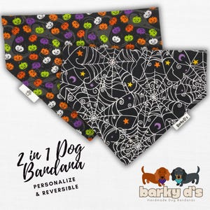 May include: Two-sided dog bandana with a black background. One side features a pattern of orange, green, and white pumpkins. The other side features a white spiderweb pattern with stars and moons. The bandana is labeled "2 in 1 Dog Bandana, Personalize & Reversible" and "Barky D's Handmade Dog Bandanas".