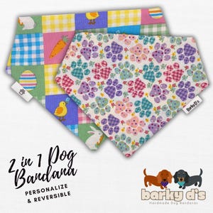 May include: Two reversible dog bandanas with Easter-themed patterns. One side features a patchwork design with pastel colors, chicks, carrots, and eggs. The other side has a white background with paw prints, flowers, and checkered patterns. The bandanas are labeled "2 in 1 Dog Bandana, Personalize & Reversible" and "Barky D's Handmade Dog Bandanas".