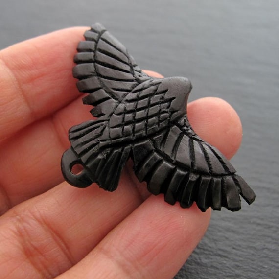 Carved buffalo horn raven pendant P460
