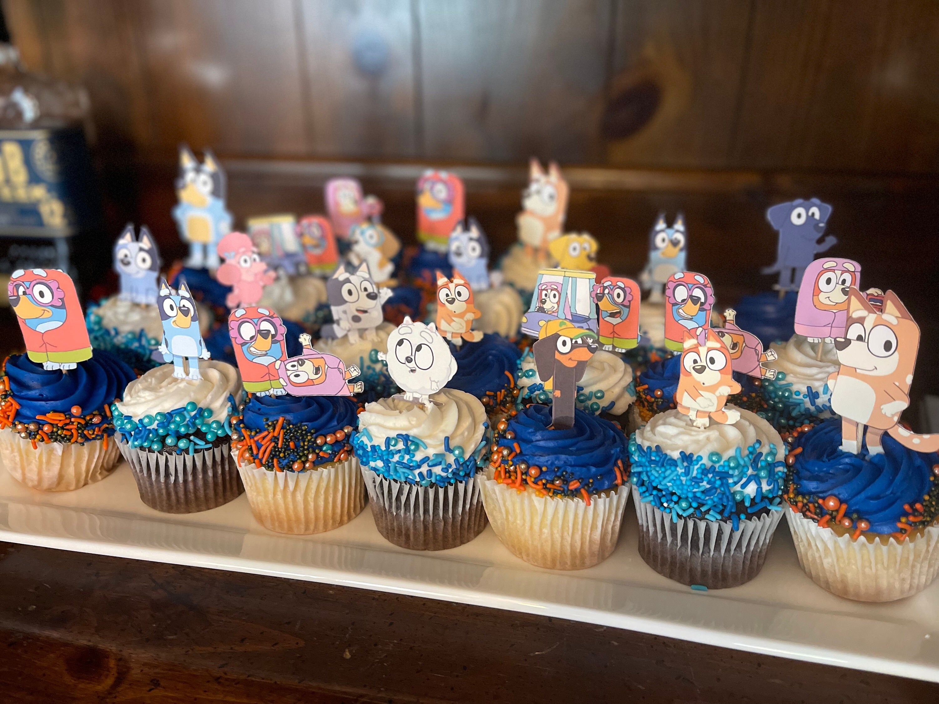 4. Bluey Cupcake Toppers- double sidedComes in set of 15, 30 or 45 cupcake toppers.They are 2 inches tall & width varies by design of the character. Processing time: 3-5 business days**Delivery time: can take up to two weeks, make sure to order early for your event!!** Feel free to message me with any questions or requests!