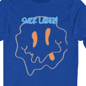 May include: A royal blue long-sleeve t-shirt with a dripping smiley face graphic and the text "SICK LATERN" above it.
