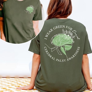 I Wear Green cerebral palsy support shirt with green brain artwork and awareness message. Cerebral palsy awareness tee created for CP warriors, survivors, caregivers, and supporters to promote understanding and visibility during awareness events or daily wear.