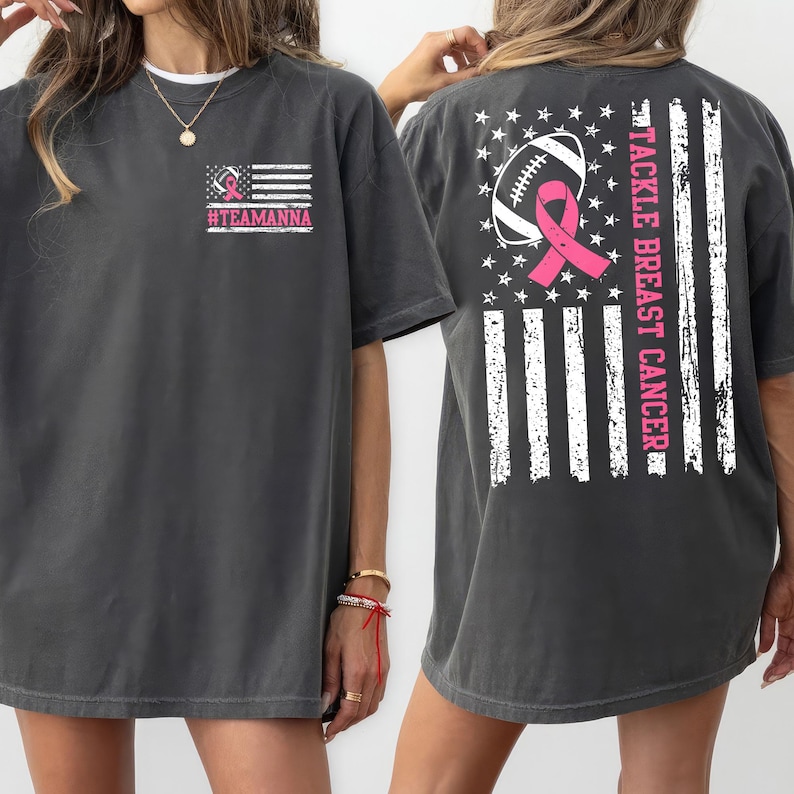 Custom tackle breast cancer awareness shirt with football and pink ribbon design over a distressed American flag. Perfect for October breast cancer awareness month, school game days, charity walks, and fundraising events. A meaningful pink ribbon shirt for survivors, supporters, nurses, and families.
