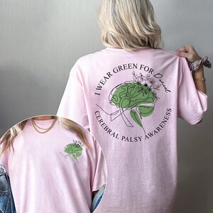Cerebral palsy awareness month shirt showcasing green brain graphic and supportive typography. Thoughtful CP warrior gift or survivor gift, designed to raise awareness and show solidarity with individuals living with cerebral palsy.