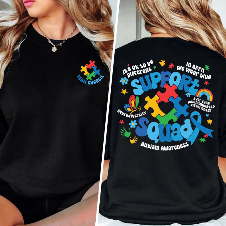 May include: Black t-shirt with a colorful puzzle piece design on the back. The design includes the text "Support Squad" and "Autism Awareness". The front of the shirt has a smaller puzzle piece design with the text "Team Charlie".
