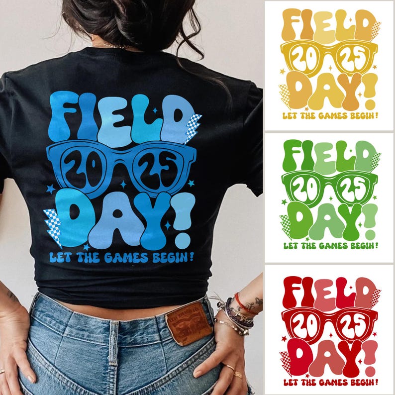 May include: A black t-shirt with a blue, white, and black graphic design that says "FIELD 2025 DAY! LET THE GAMES BEGIN!"