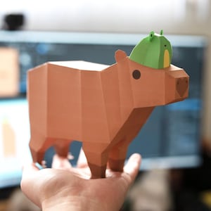 Ensemble de mini motifs papercrafts capybaras et grenouilles low poly