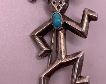 Navajo Yei sterling silver brooch/ pin with turquoise cabochon.  Made by silversmith Felix Joe.