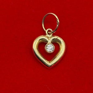 Pendentif coeur en or jaune 10 kt avec zircone cubique