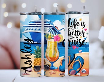 May include: Three stainless steel insulated tumblers with a cruise theme. One has the name "Ashley", another a cocktail, and the third says "Life is better on a cruise". Each tumbler has a straw.