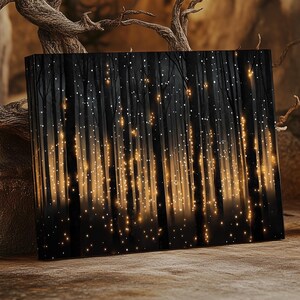 May include: A black canvas print with a dark forest scene. The trees are silhouetted against a background of twinkling lights. The print is framed with a thin black border.