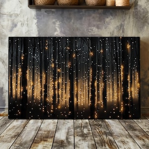 May include: A black and white canvas print depicting a forest scene with glowing lights. The lights are strung between the trees and create a magical atmosphere.