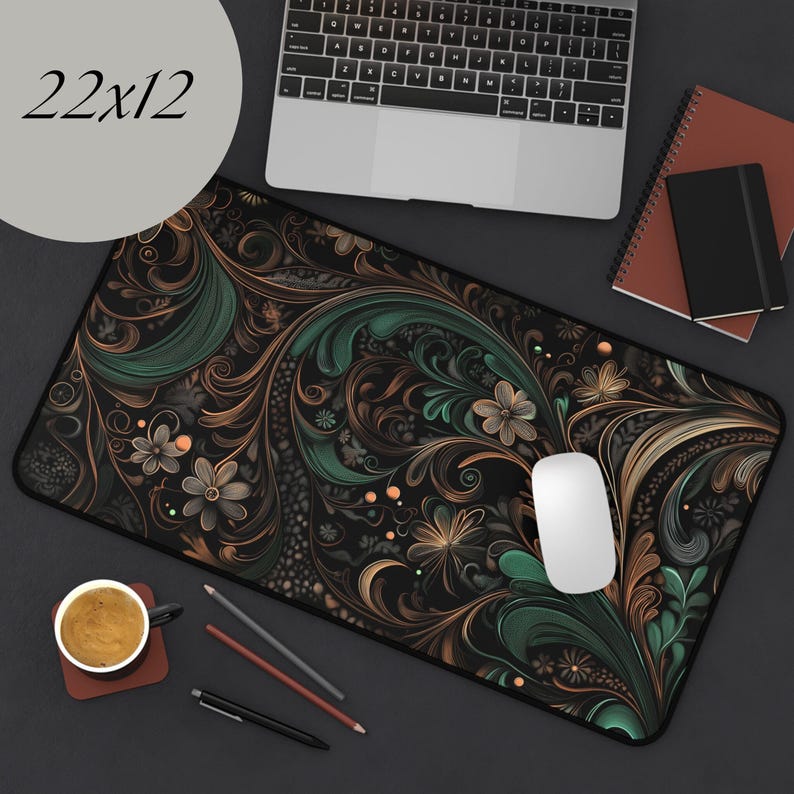 May include: A black, green, and gold floral patterned mousepad with a white computer mouse on top. The mousepad is 22 inches by 12 inches.