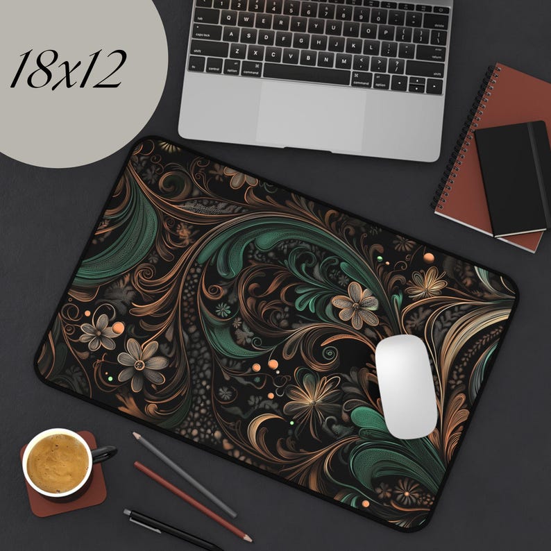 May include: A black mouse pad with a green and gold floral pattern. The mouse pad is 18 inches by 12 inches.