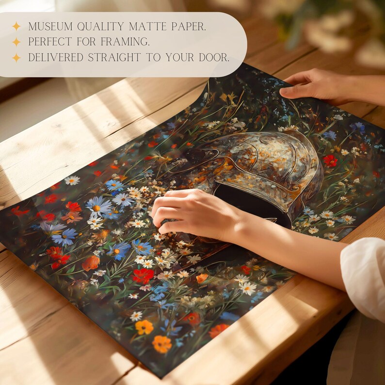 May include: A close-up of a print featuring a rusty helmet lying in a field of colorful wildflowers. The print is on a matte paper surface.