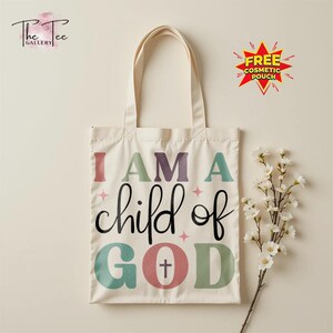 May include: A cream-colored tote bag with the text "I AM A child of GOD" in colorful letters. The bag has long handles and a simple design, suitable for carrying various items. A free cosmetic pouch is advertised.