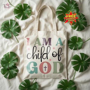 May include: A cream-colored tote bag with the text "I AM A child of GOD" in colorful letters. The bag has a cross symbol and is surrounded by green leaves. A free cosmetic pouch is also included.