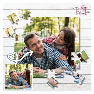 May include: A personalized jigsaw puzzle featuring a photo of a father and child. The puzzle is partially assembled, with some pieces scattered around. The image shows a man and a girl smiling and embracing. The puzzle is on a white wooden surface.