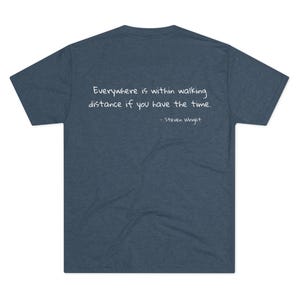 May include: A dark blue t-shirt with a white quote that reads "Everywhere is within walking distance if you have the time. - Steven Wright"